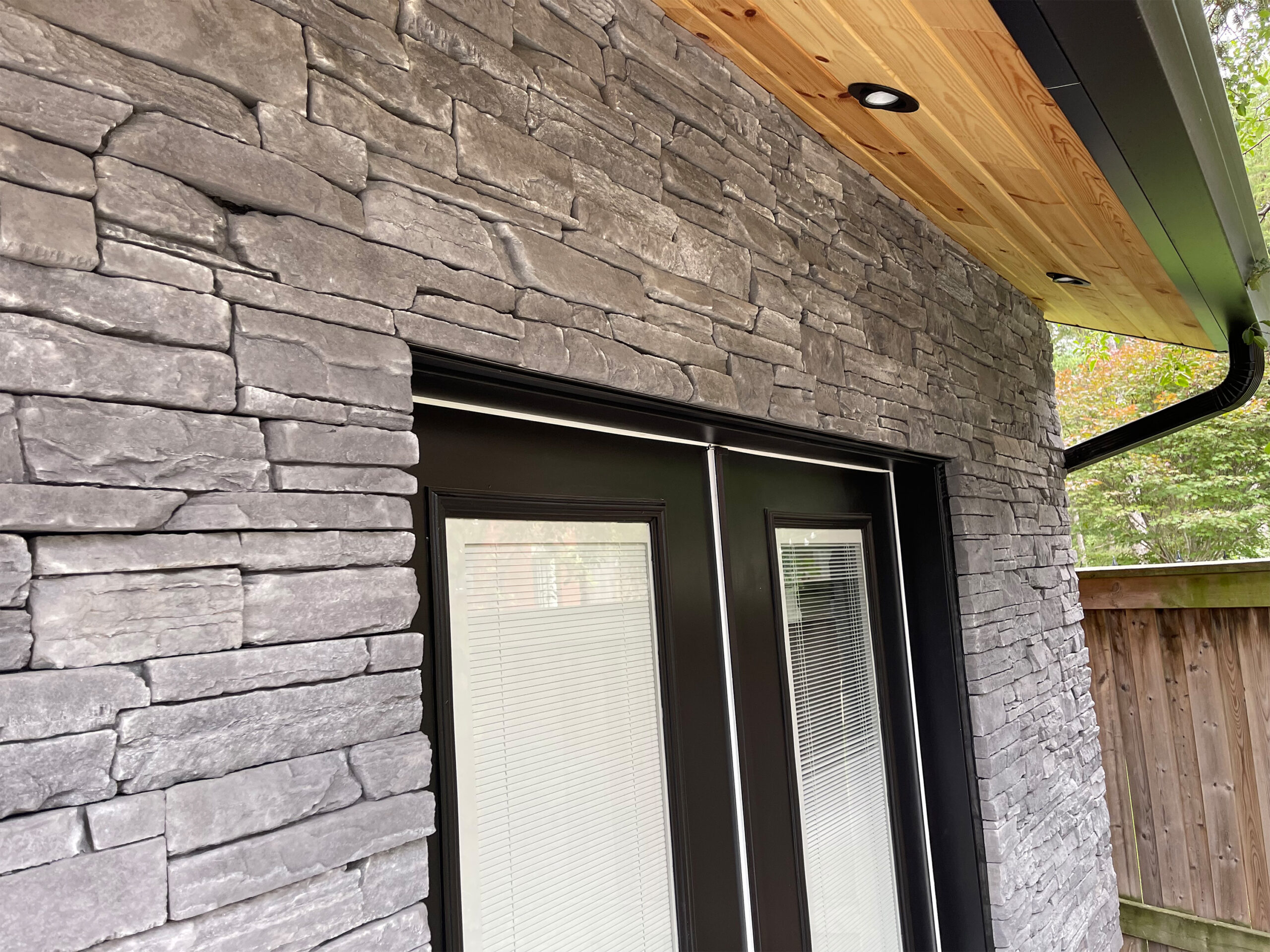 Sedistone stone veneer surrounding exterior double doors